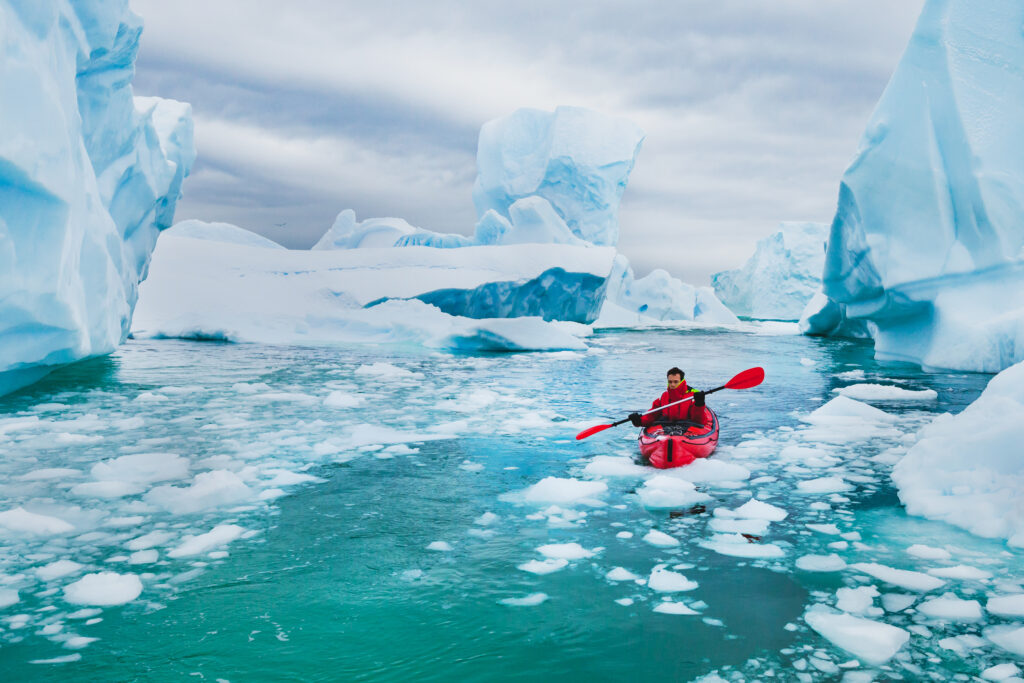 Kayaking among icebergs in Antarctica